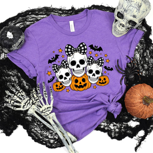 SKULLS WITH BOWS AND PUMPKINS